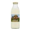 Glass bottle with metal cap, labeled "Real Milk" featuring cows in a field image.