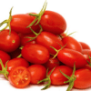 Pile of ripe grape tomatoes with smooth skin, green stems, and one sliced open, showing seeds.