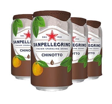 Four cans of Sanpellegrino Chinotto with fruit images and red star logo.