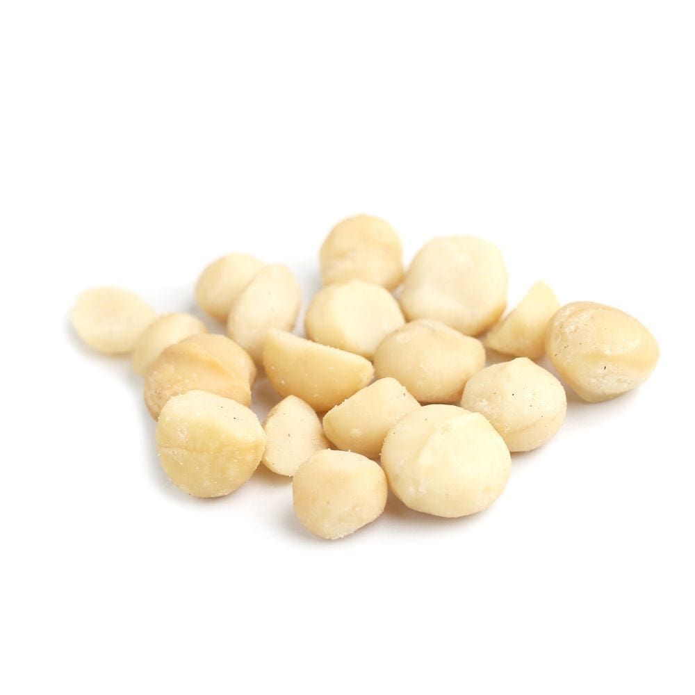 Collection of shelled macadamia nuts on a white background, varying in size and smoothness.