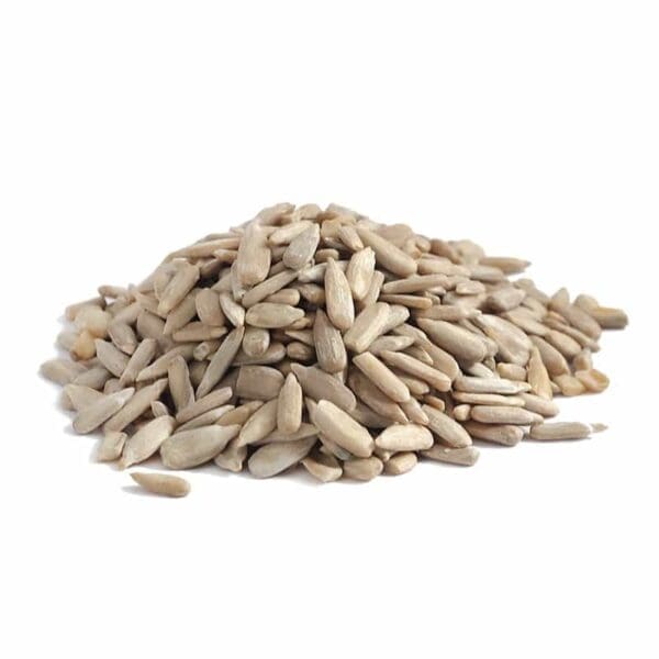 Pile of shelled sunflower seeds on a plain white background.
