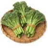 Woven bamboo tray with fresh broccolini bundles, dark green stalks and florets secured with bands.