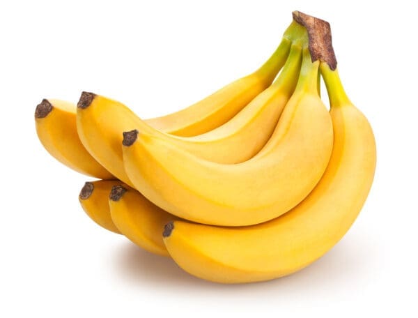 Ripe yellow bananas with curved shape and intact stems on a white background.