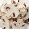 Sliced white mushrooms with visible gills, showcasing a fresh and crisp appearance.