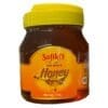 Jar of Sofiko Fine Foods natural honey with yellow label and 1 kg net weight.
