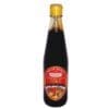 Glass bottle with yellow cap containing sweet soy sauce, red and gold label with dish imagery.