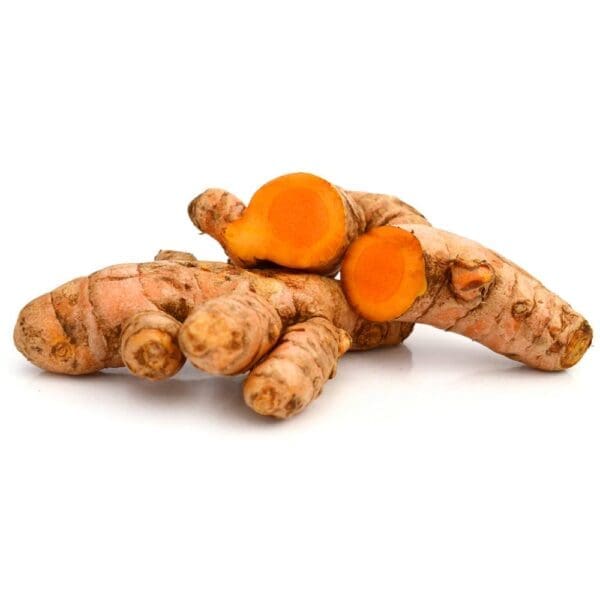 Turmeric roots with rough brown skin and vibrant orange interior, some cut to show inside.