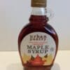 Urban Pantry organic maple syrup bottle, labeled 100% pure Canadian, with round shape and handle.