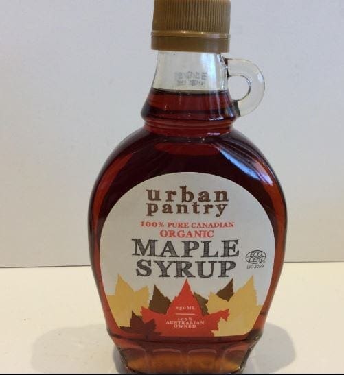 Urban Pantry organic maple syrup bottle, labeled 100% pure Canadian, with round shape and handle.