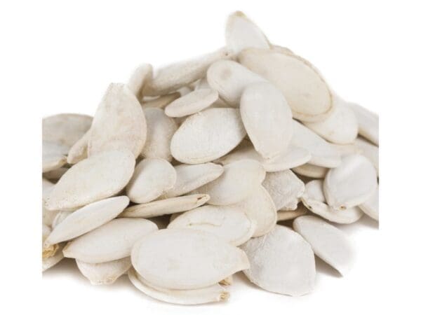 Pile of white pumpkin seeds on white background, smooth, flat, and oval in shape.