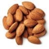 Whole almonds with brown textured skins scattered on a plain white background.