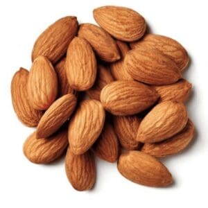 Whole almonds with brown textured skins scattered on a plain white background.
