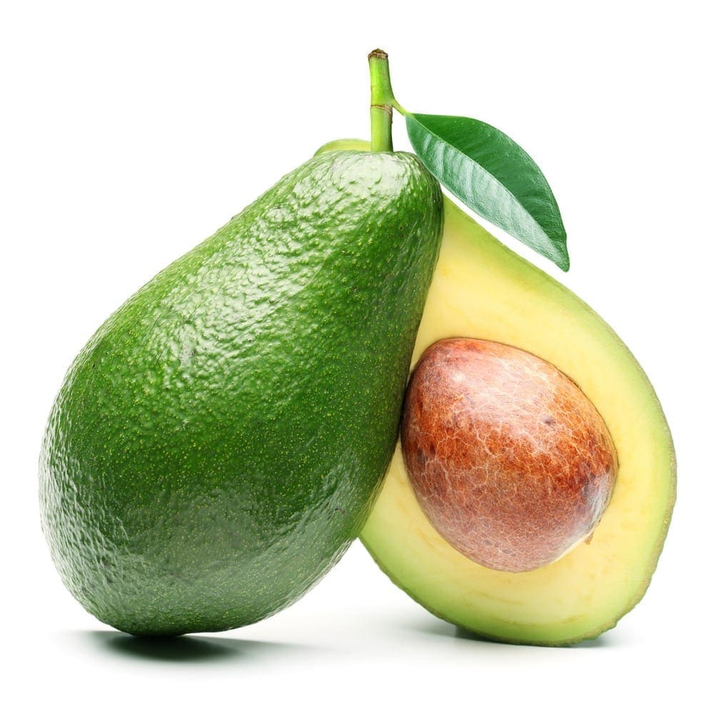 Whole avocado with half, pit visible, dark green skin, leaf attached, white background.