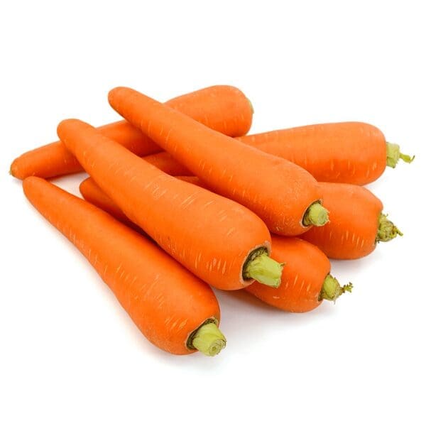 Whole carrots with bright orange skin and green tops on a white background.