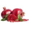 Two whole pomegranates and a cut section with seeds, placed on a white background with leaves.