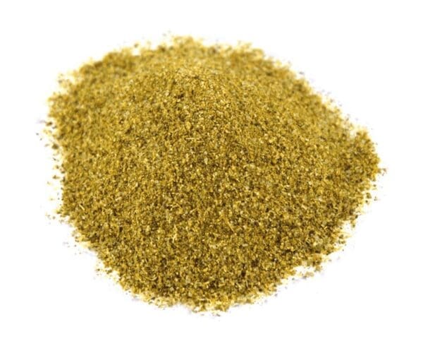 Small pile of finely ground, yellowish-green powder on a white background.